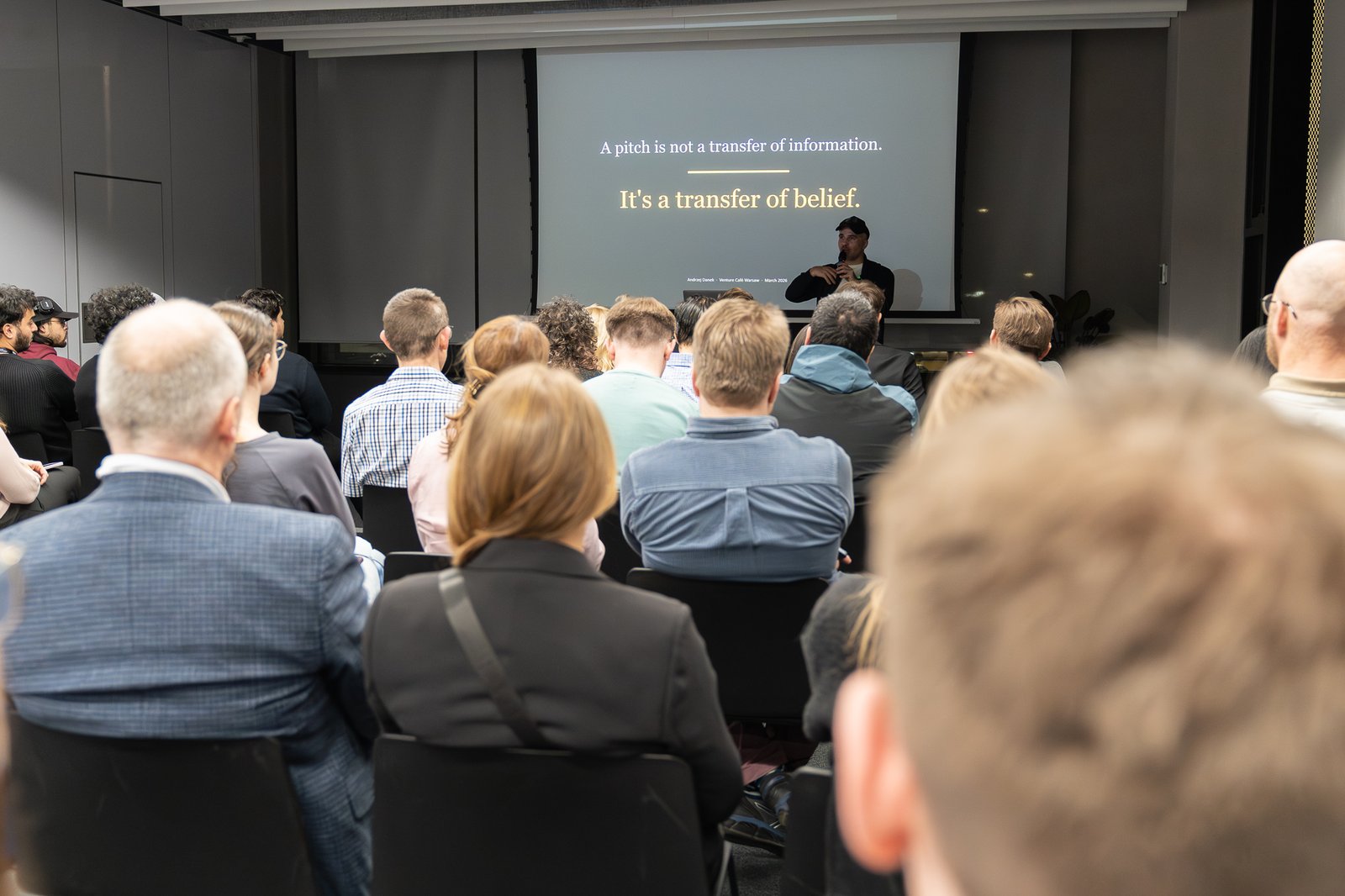 Andrzej Danek speaking to an audience at Venture Café Warsaw
